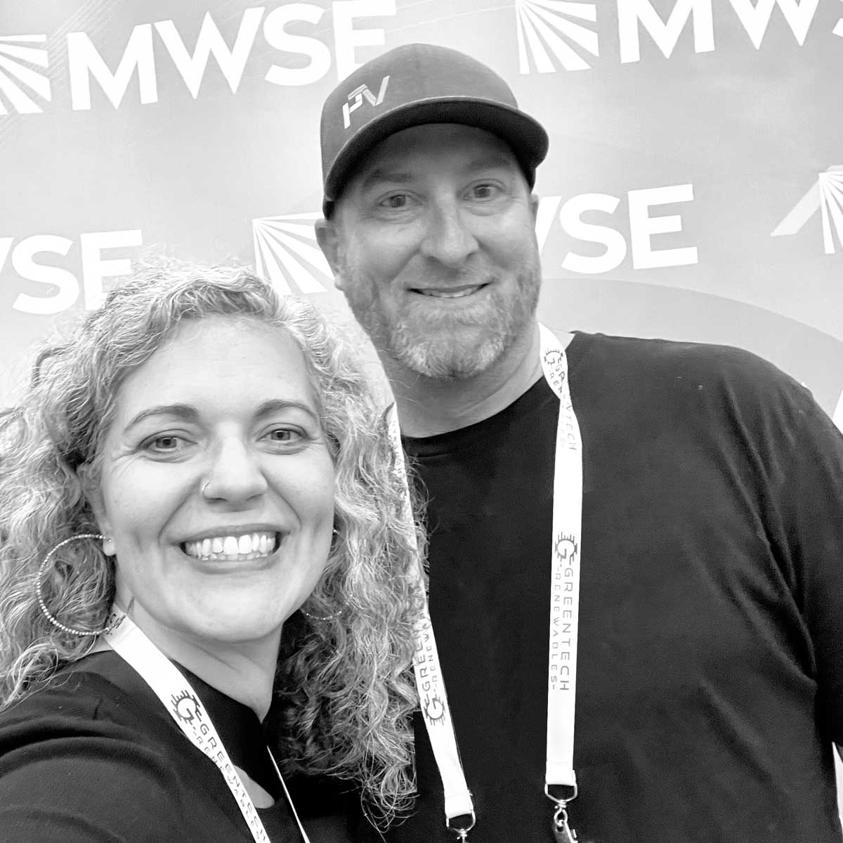 Two people from PVpallet pose for a selfie at midwest solar expo.