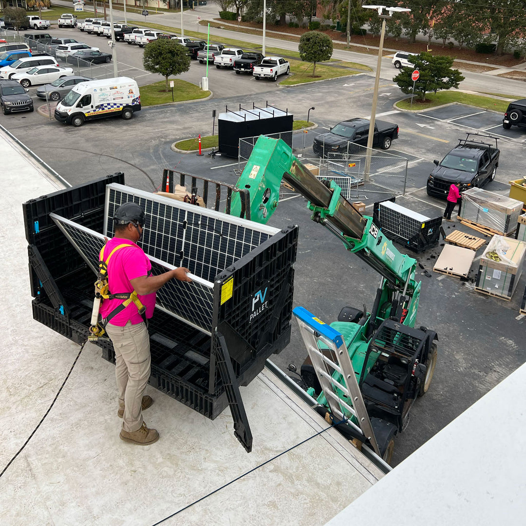 Commercial solar installer using PVpallet reusable panel pallets on a jobsite