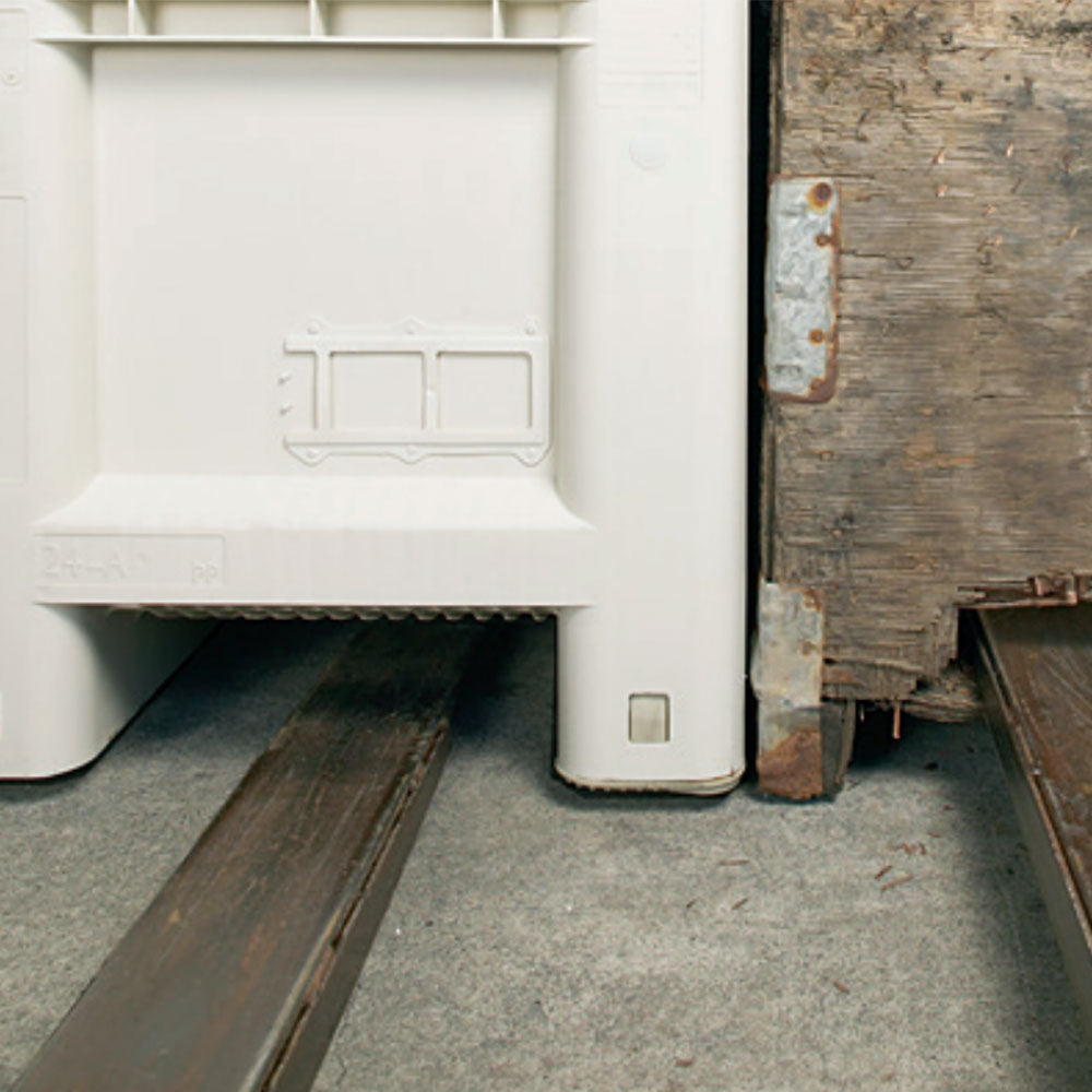 Foot of wood bin versus plastic solid walled agriculture bin. Plastic agriculture bins are durable and virtually maintenance free.