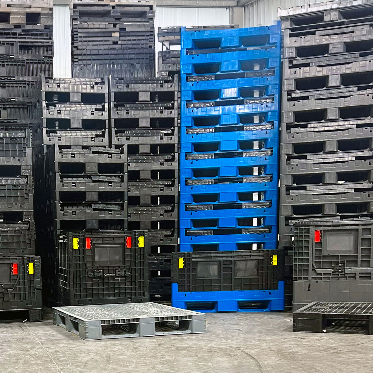 Pallets and Bins warehouse storage with collapsible bulk containers and rackable plastic pallets
