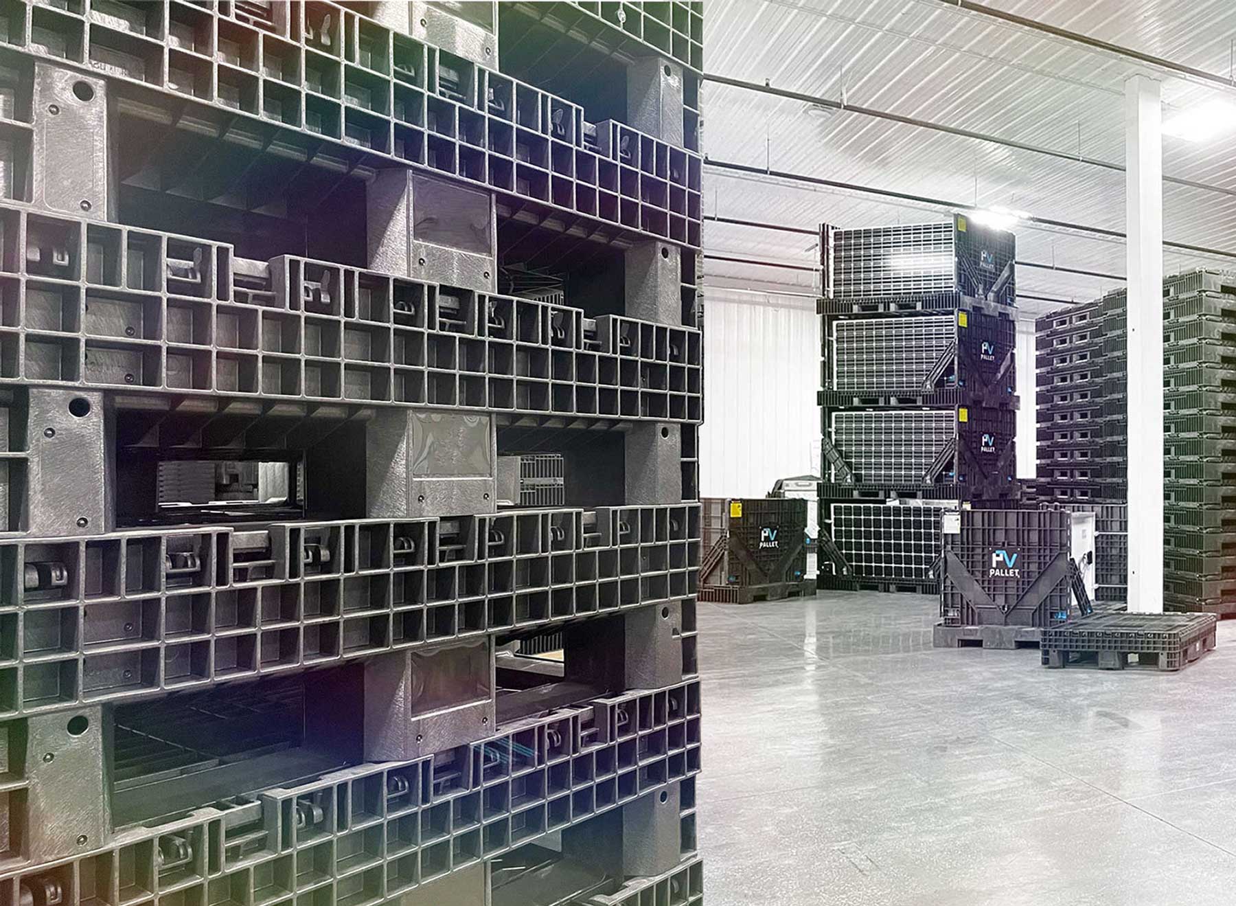 Stacks of pallets and bulk containers in PVpallet warehouse